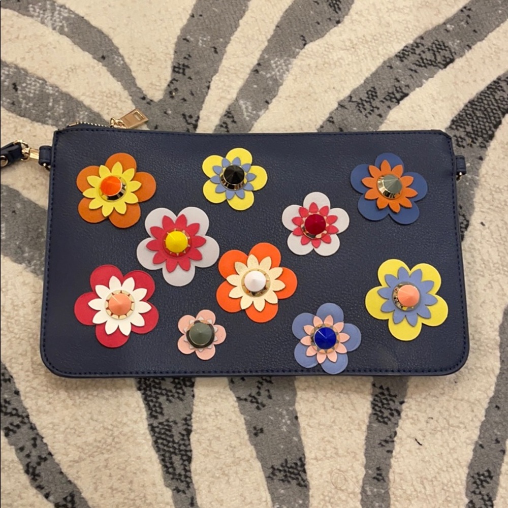 Navy blue clutch. Gold strap comes with it.